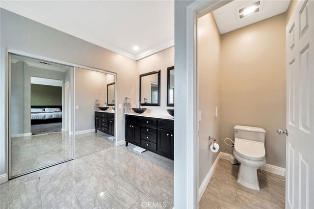 16139 Crooked Creek Ct, Chino Hills, CA 91709 - full bathroom featuring double vanity, connected bathroom, ornamental molding, toilet, and baseboards