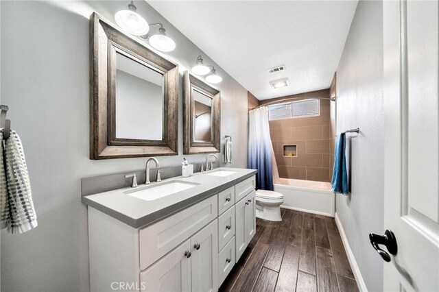 16139 Crooked Creek Ct, Chino Hills, CA 91709 - full bath with double vanity, toilet, shower / tub combo, baseboards, and wood finished floors