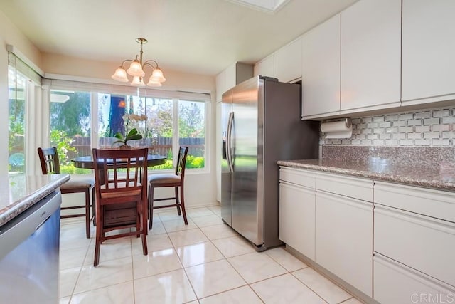 543 Boysenberry Way, Oceanside, CA 92057 - kitchen featuring stainless steel appliances, decorative backsplash, a chandelier, white cabinetry, and hanging light fixtures