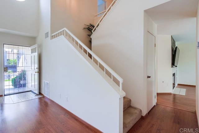 543 Boysenberry Way, Oceanside, CA 92057 - stairs featuring wood finished floors and a towering ceiling