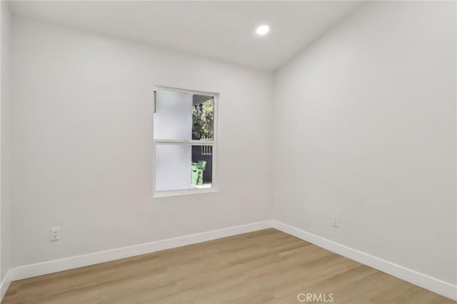 12548 Terra Bella St, Pacoima, CA 91331 - unfurnished room with baseboards, light wood-type flooring, and recessed lighting