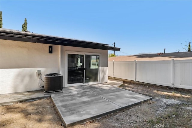 12548 Terra Bella St, Pacoima, CA 91331 - rear view of property with central AC, a patio area, and stucco siding