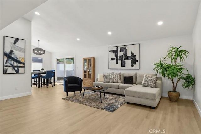 12548 Terra Bella St, Pacoima, CA 91331 - living room with wood finished floors, baseboards, recessed lighting, a chandelier, and vaulted ceiling