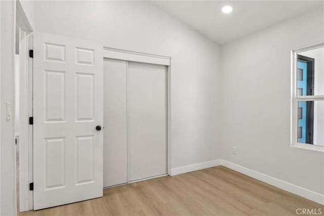 12548 Terra Bella St, Pacoima, CA 91331 - unfurnished bedroom featuring light wood-style flooring, baseboards, recessed lighting, and a closet