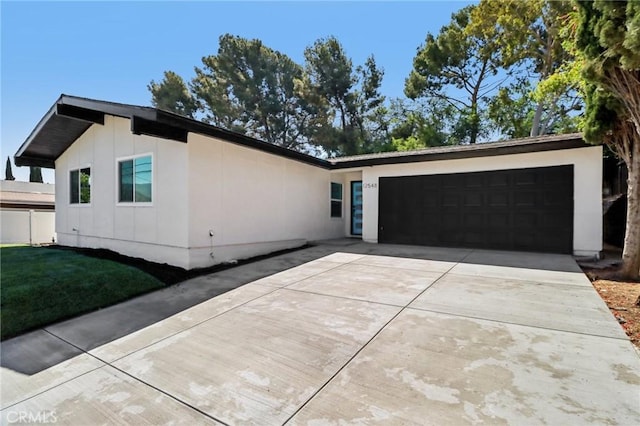 12548 Terra Bella St, Pacoima, CA 91331 - view of front of home featuring concrete driveway and an attached garage