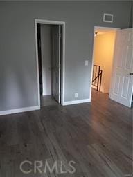 1725 Neil Armstrong St Unit 103, Montebello, CA 90640 - unfurnished bedroom with baseboards and wood finished floors