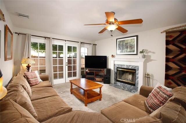 8630 Forsythe St, Sunland, CA 91040 - living room with carpet, ceiling fan, french doors, and a fireplace