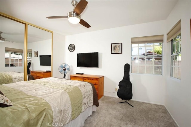 8630 Forsythe St, Sunland, CA 91040 - bedroom with multiple windows, light carpet, a closet, and ceiling fan