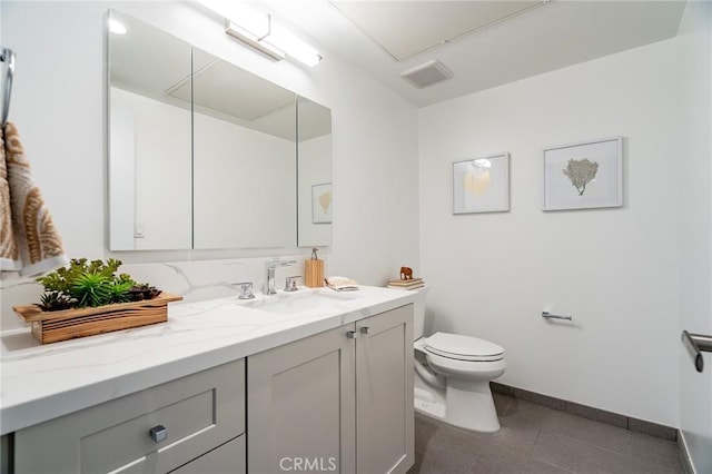 137 S Wilson Ave Unit 105, Pasadena, CA 91106 - bathroom featuring vanity, toilet, baseboards, and tile patterned flooring