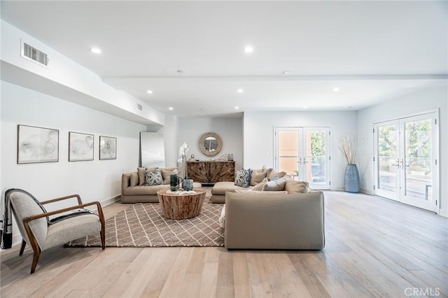 137 S Wilson Ave Unit 105, Pasadena, CA 91106 - living room featuring light wood-type flooring, recessed lighting, french doors, and baseboards