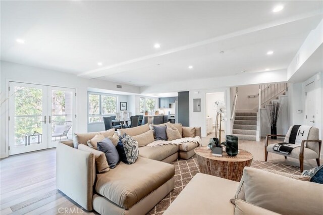 137 S Wilson Ave Unit 105, Pasadena, CA 91106 - living room with stairway, light wood-type flooring, recessed lighting, french doors, and beamed ceiling