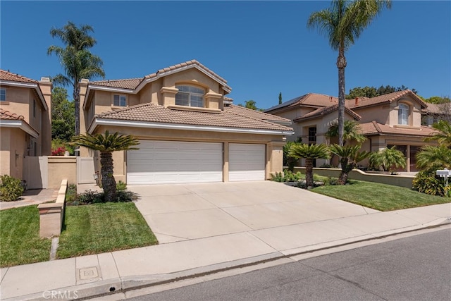 26121 Calle Cresta, Mission Viejo, CA 92692 - mediterranean / spanish home featuring driveway, stucco siding, and a tiled roof