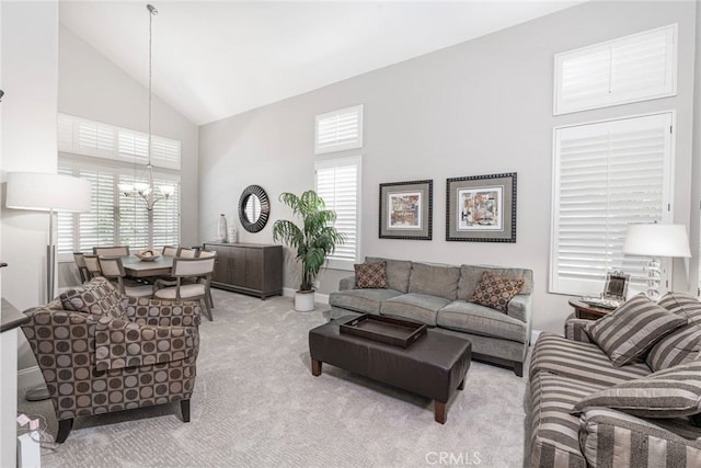 26121 Calle Cresta, Mission Viejo, CA 92692 - carpeted living room featuring high vaulted ceiling, a chandelier, and plenty of natural light