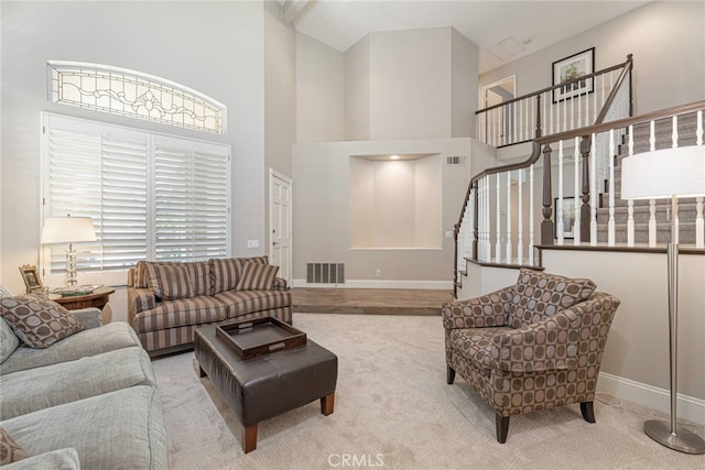 26121 Calle Cresta, Mission Viejo, CA 92692 - living room with baseboards, stairway, a towering ceiling, plenty of natural light, and carpet flooring