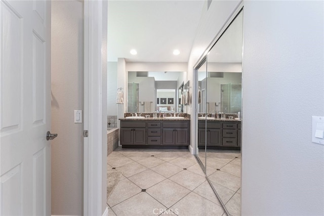 26121 Calle Cresta, Mission Viejo, CA 92692 - full bathroom with double vanity, tile patterned flooring, tiled bath, and recessed lighting