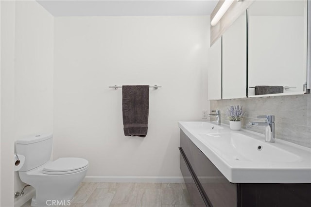 3409 W 175th St, Torrance, CA 90504 - bathroom with double vanity, baseboards, and toilet