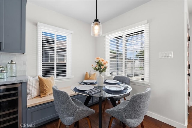 3409 W 175th St, Torrance, CA 90504 - dining area featuring beverage cooler, healthy amount of natural light, dark wood-type flooring, and baseboards