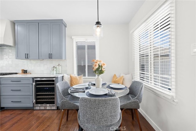 3409 W 175th St, Torrance, CA 90504 - dining space featuring wine cooler, dark wood-style flooring, and baseboards