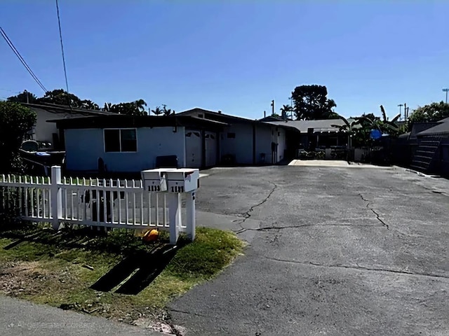 11331135 Gardena Rd, Encinitas, CA 92024 - ranch-style home featuring a garage and asphalt driveway