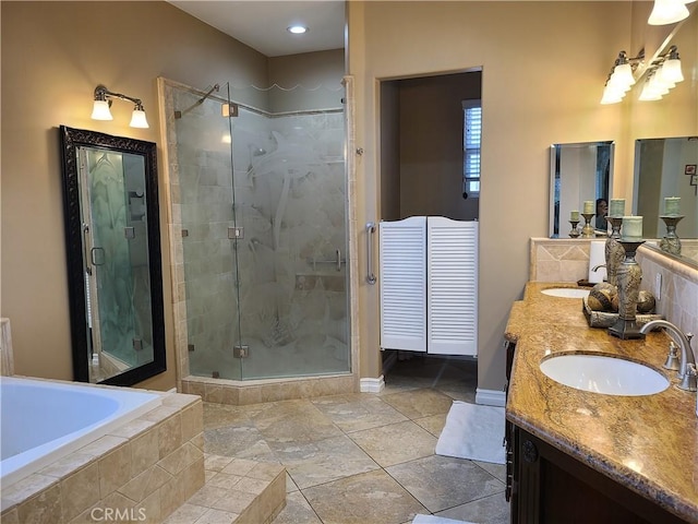 6116 Chadbourne Ave, Riverside, CA 92505 - full bathroom featuring a shower stall, double vanity, a bath, and baseboards