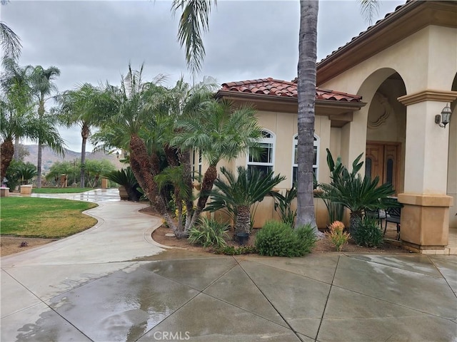 6116 Chadbourne Ave, Riverside, CA 92505 - view of home's exterior with stucco siding and a tiled roof