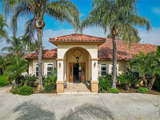 6116 Chadbourne Ave, Riverside, CA 92505 - mediterranean / spanish-style home featuring a tiled roof and stucco siding