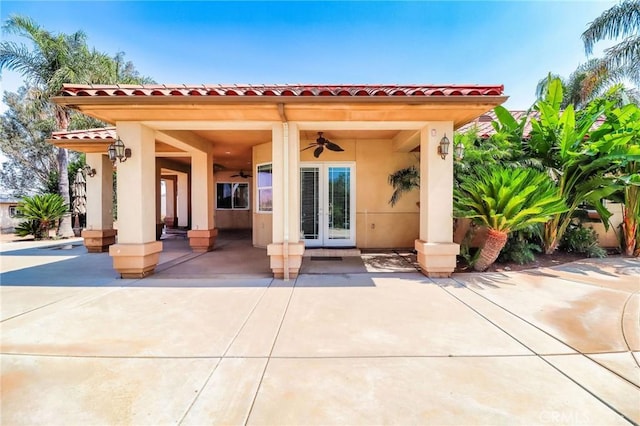 6116 Chadbourne Ave, Riverside, CA 92505 - back of property featuring ceiling fan, a tile roof, and stucco siding