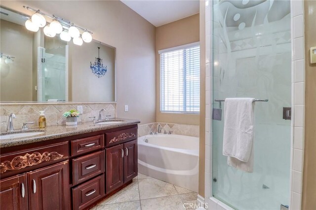 6116 Chadbourne Ave, Riverside, CA 92505 - bathroom with double vanity, a stall shower, a garden tub, and tile patterned floors