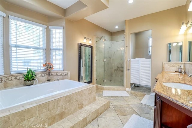 6116 Chadbourne Ave, Riverside, CA 92505 - full bathroom with double vanity, a marble finish shower, a garden tub, tile patterned floors, and recessed lighting