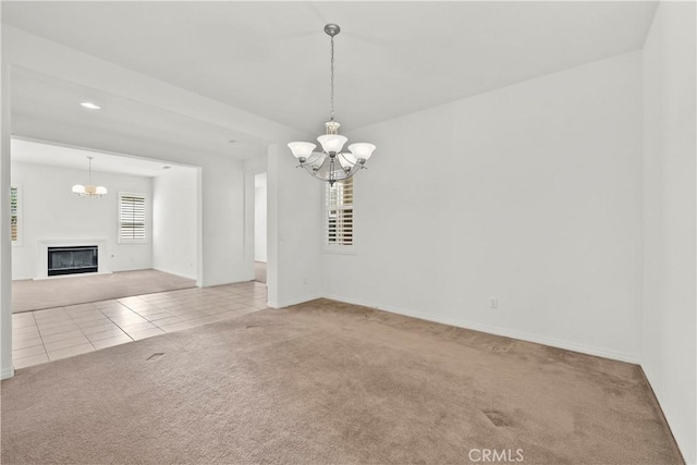 28538 Redwood Canyon Pl, Saugus, CA 91390 - carpeted empty room with a chandelier, tile patterned flooring, and baseboards