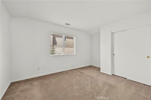 28538 Redwood Canyon Pl, Saugus, CA 91390 - unfurnished bedroom with carpet flooring, baseboards, a closet, and lofted ceiling