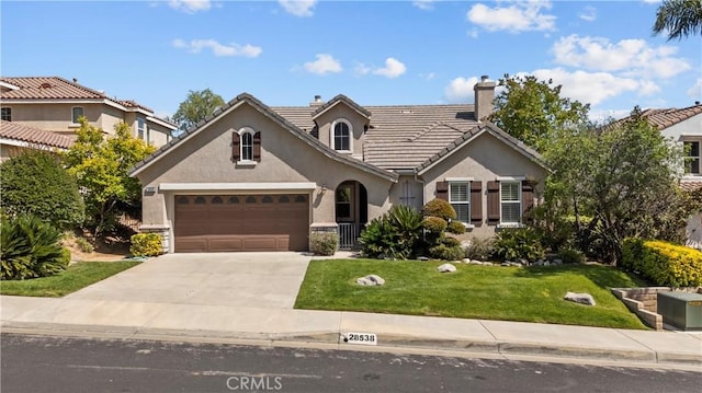 28538 Redwood Canyon Pl, Saugus, CA 91390 - view of front of house featuring concrete driveway, stucco siding, a front lawn, an attached garage, and a chimney