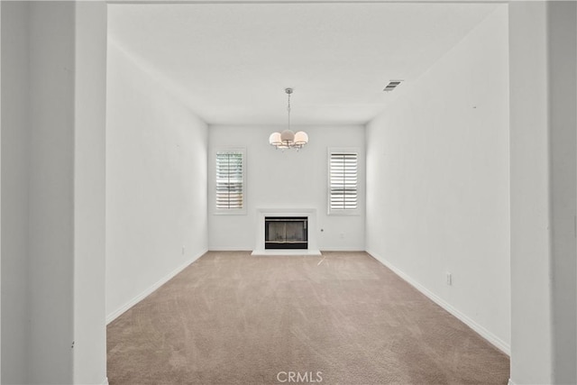 28538 Redwood Canyon Pl, Saugus, CA 91390 - unfurnished living room featuring light colored carpet, a chandelier, a glass covered fireplace, and baseboards