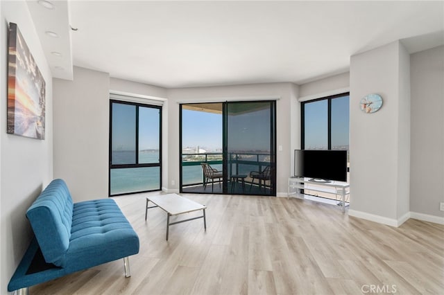 1310 E Ocean Blvd Unit 1103, Long Beach, CA 90802 - unfurnished living room with wood finished floors and baseboards