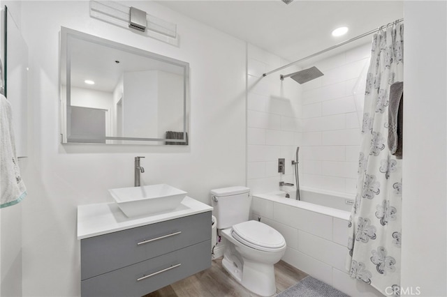 1310 E Ocean Blvd Unit 1103, Long Beach, CA 90802 - bathroom featuring tiled shower / bath, toilet, wood finished floors, vanity, and recessed lighting
