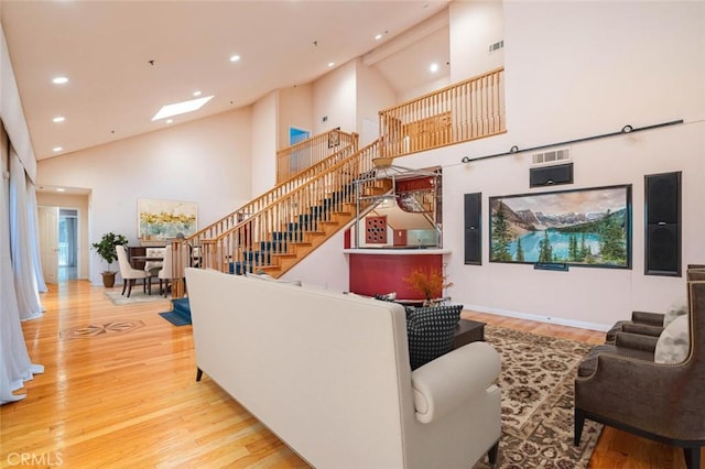3300 Beaudry, Glendale, CA 91208 - living room featuring high vaulted ceiling, wood finished floors, recessed lighting, stairs, and a skylight