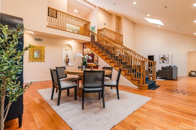 3300 Beaudry, Glendale, CA 91208 - dining room featuring high vaulted ceiling, stairs, recessed lighting, wood finished floors, and a skylight