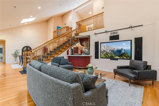 3300 Beaudry, Glendale, CA 91208 - living room with high vaulted ceiling, stairs, wood finished floors, a skylight, and recessed lighting
