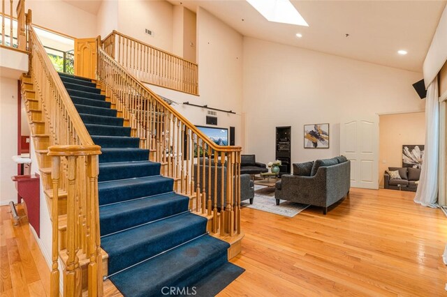 3300 Beaudry, Glendale, CA 91208 - stairway featuring a skylight, wood finished floors, high vaulted ceiling, and recessed lighting