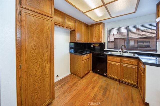 2440 Chandler Ave Unit 4, Simi Valley, CA 93065 - kitchen featuring dishwasher, a sink, dark countertops, brown cabinets, and light wood-type flooring