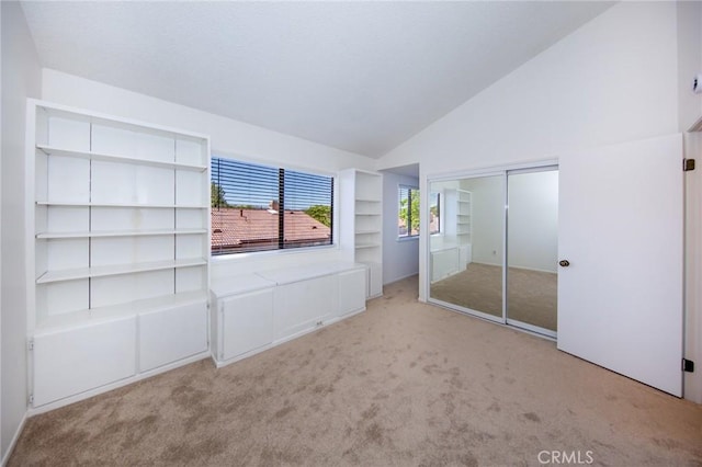 2440 Chandler Ave Unit 4, Simi Valley, CA 93065 - unfurnished bedroom featuring carpet flooring, a closet, and high vaulted ceiling