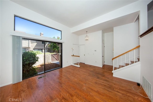 2440 Chandler Ave Unit 4, Simi Valley, CA 93065 - empty room featuring wood finished floors and stairway