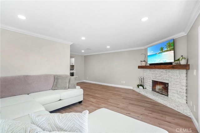 308 S Cabrillo Ave Unit 3, San Pedro, CA 90731 - living room with crown molding, baseboards, recessed lighting, wood finished floors, and a stone fireplace