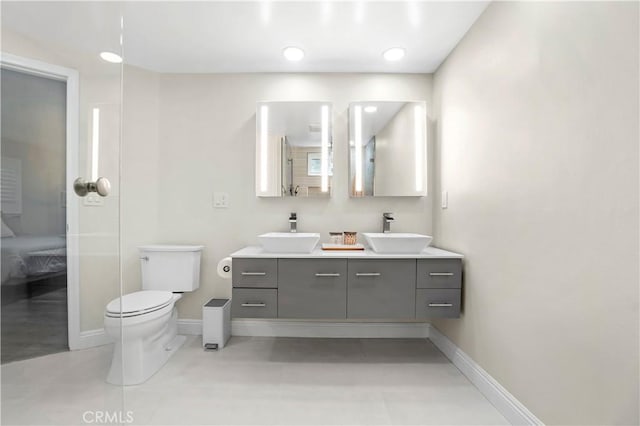 308 S Cabrillo Ave Unit 3, San Pedro, CA 90731 - bathroom with double vanity, baseboards, and toilet