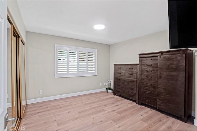 308 S Cabrillo Ave Unit 3, San Pedro, CA 90731 - bedroom featuring light wood-type flooring, baseboards, and a closet