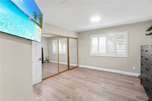 308 S Cabrillo Ave Unit 3, San Pedro, CA 90731 - unfurnished bedroom with light wood-style flooring, baseboards, and a closet