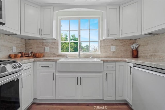 308 S Cabrillo Ave Unit 3, San Pedro, CA 90731 - kitchen with stainless steel appliances, a sink, white cabinets, and light countertops
