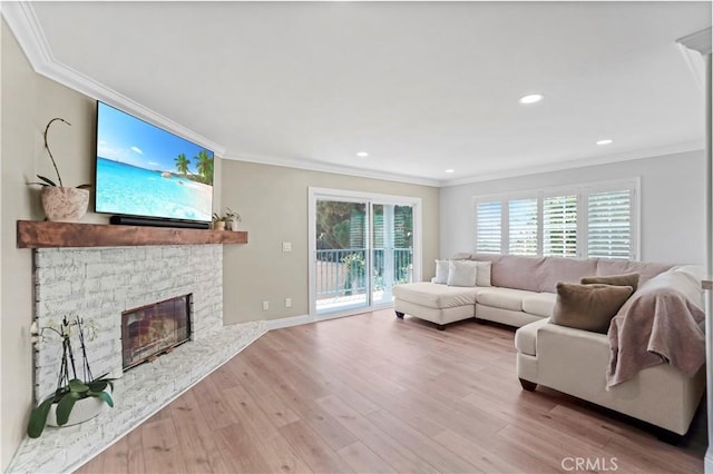 308 S Cabrillo Ave Unit 3, San Pedro, CA 90731 - living area with ornamental molding, wood finished floors, a stone fireplace, recessed lighting, and baseboards