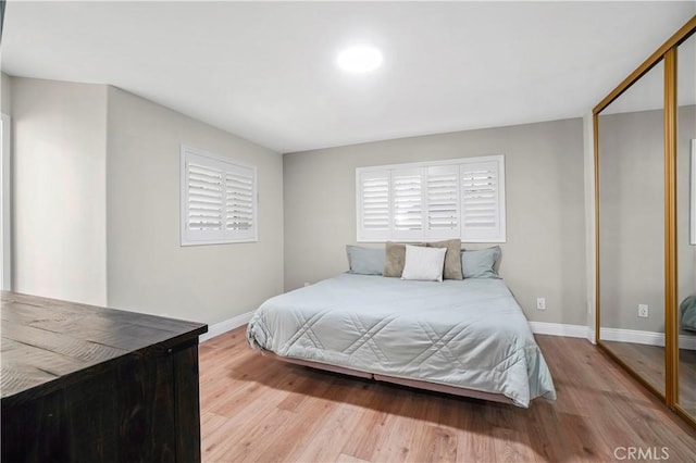 308 S Cabrillo Ave Unit 3, San Pedro, CA 90731 - bedroom featuring baseboards, wood finished floors, and a closet