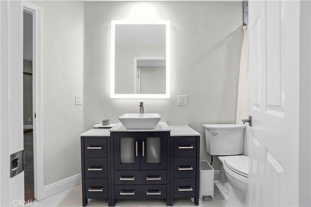 308 S Cabrillo Ave Unit 3, San Pedro, CA 90731 - bathroom featuring baseboards, vanity, and toilet